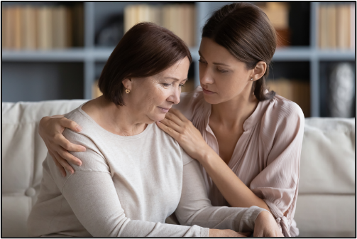 Woman comforting another woman